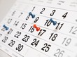 Beschreibung: Closeup calendar page with drawing-pins